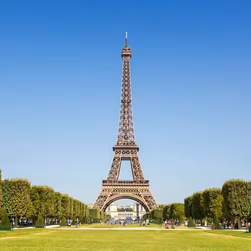 The Eiffel Tower seen from the lawns of the Champ-de-Mars on a clear day