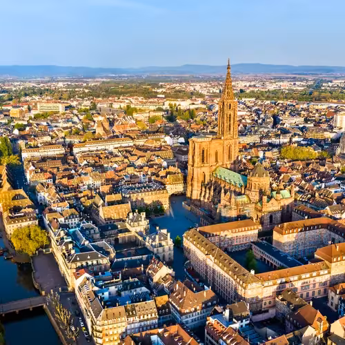 Strasbourg Cathedral above the rooftops of the city centre, seen from the air.