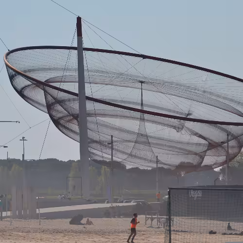 Iconic Anemona sculpture against a clear sky at Matosinhos Beach, a must-see attraction in Portugal's Norte Region.