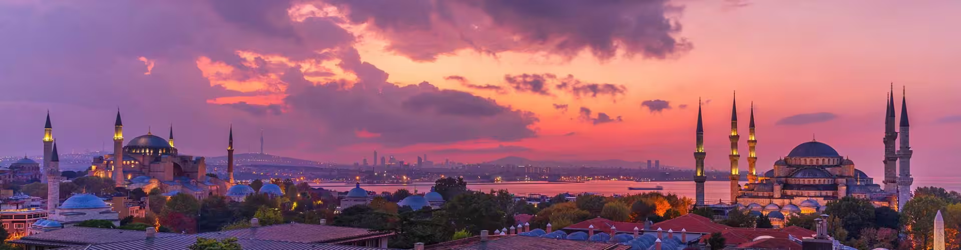 Sunset over Istanbul's iconic skyline featuring the Hagia Sophia and Blue Mosque in the Marmara Region, Turkey.