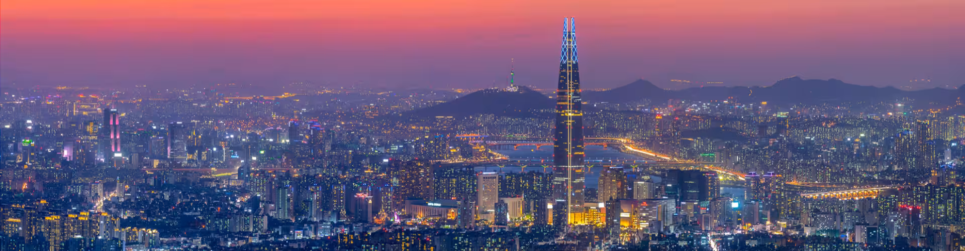 Seoul skyline at sunset featuring Lotte World Tower and the Han River, South Korea’s vibrant cityscape and top travel destination