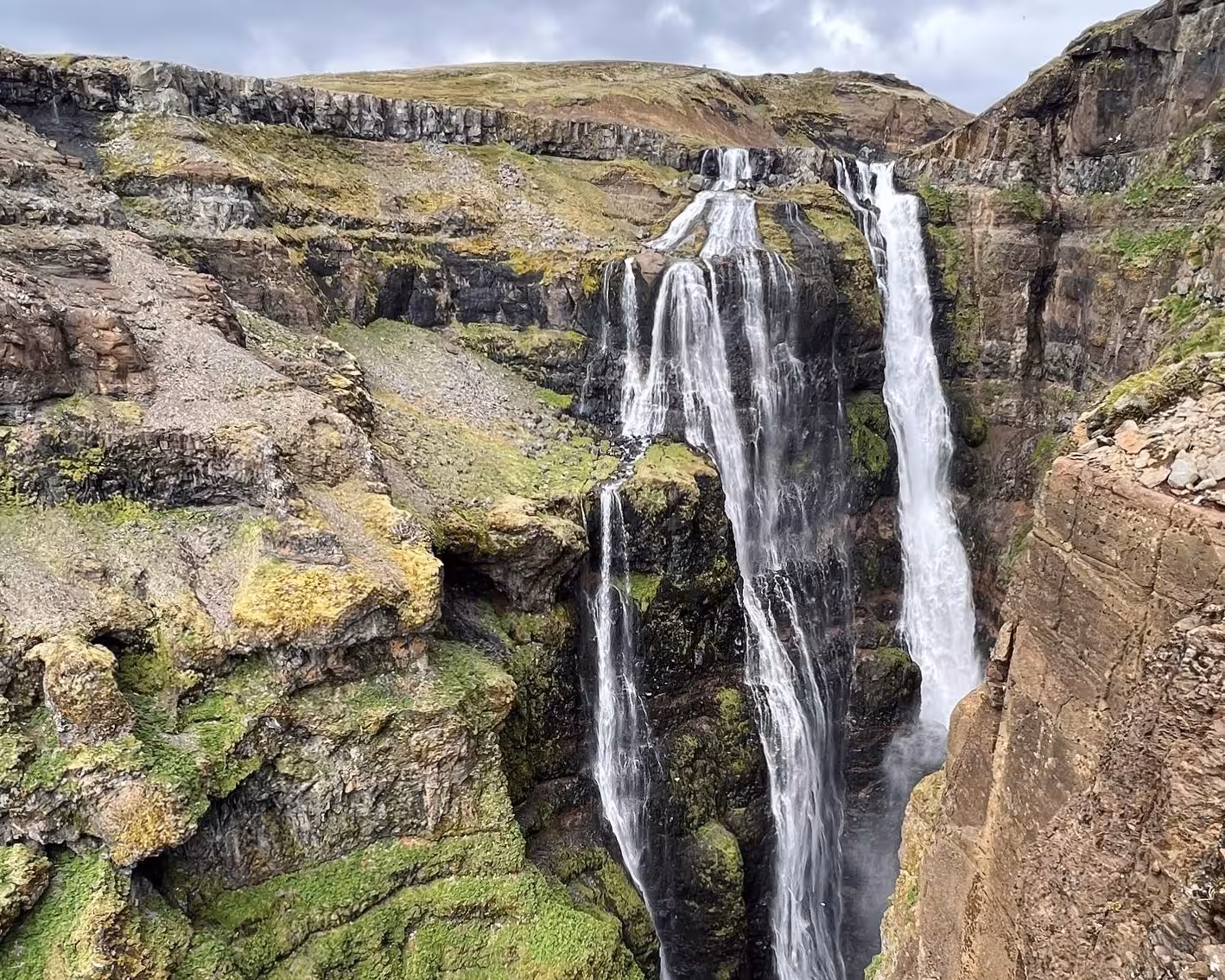 Majestic waterfall cascading over mossy cliffs, ideal for nature exploration on the 2026 Total Solar Eclipse Tour.