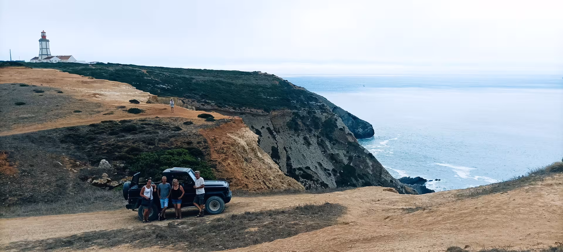4x4 jeep stop near Cabo Espichel lighthouse and cliffs, Atlantic coast panorama on Wild Cabo Espichel tour