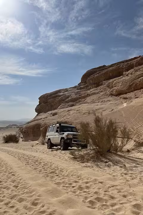 4x4 jeep crossing Sinai desert sands near Colored Canyon on Sharm El Sheikh to Blue Hole safari excursion
