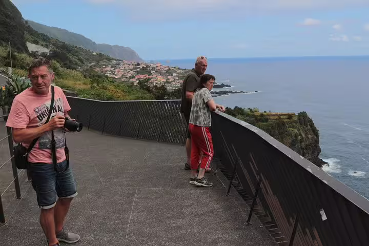 Tourists enjoy breathtaking ocean and cliff views on a scenic 4x4 Jeep tour to Porto Moniz and Fanal in Madeira.
