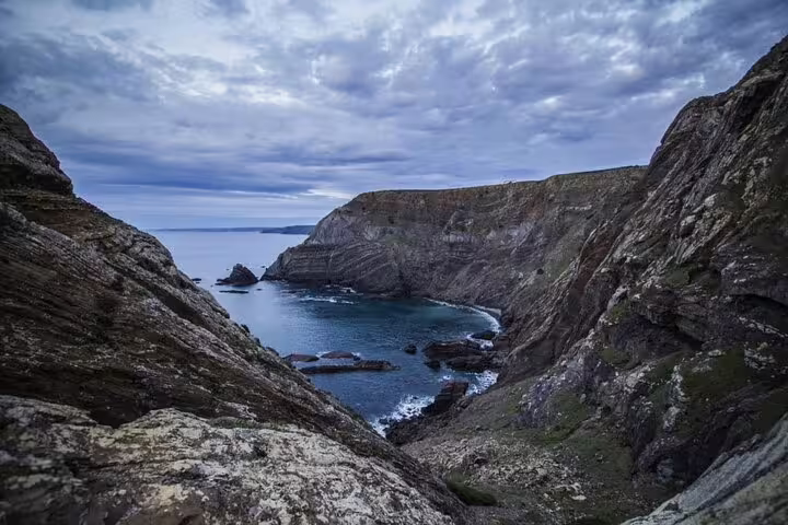Dramatic cliffs overlooking the rugged coastline of the Natural Park, ideal for an adventurous 4x4 tour.