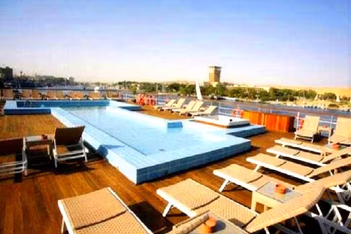 Sun deck pool and loungers on 5-star deluxe Nile cruise, private 5-day Luxor to Aswan tour