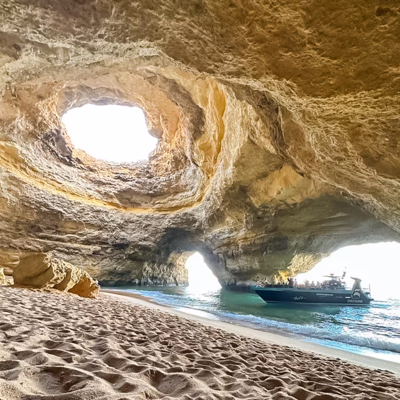 Explore the stunning Benagil Cave with its iconic skylight and a boat tour along the Algarve Coast.