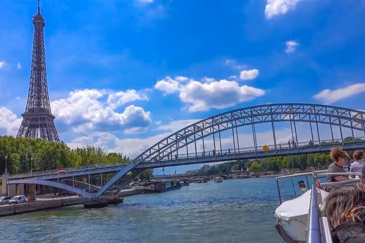 Seine River cruise view of Eiffel Tower and bridge, ideal add-on to Eiffel Tower lunch or dinner experience