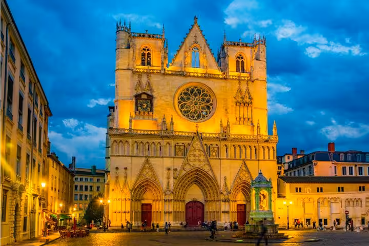 Lyon Cathedral Saint-Jean glowing at night, a spooky stop on the Lyon haunted self-guided ghost hunt walking tour.
