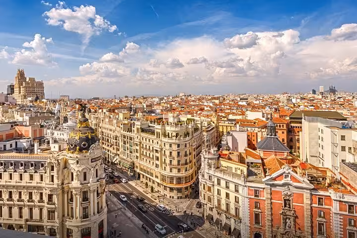 Stunning aerial panoramic view of Madrid historic city center with ornate buildings on self-guided walking tour route.
