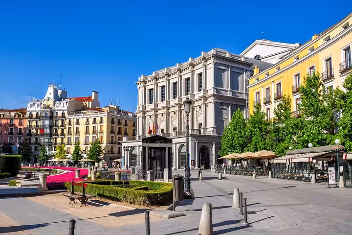 Stunning Plaza de Oriente in Madrid with historic buildings and gardens on a self-guided Escape the Inquisition walking tour.
