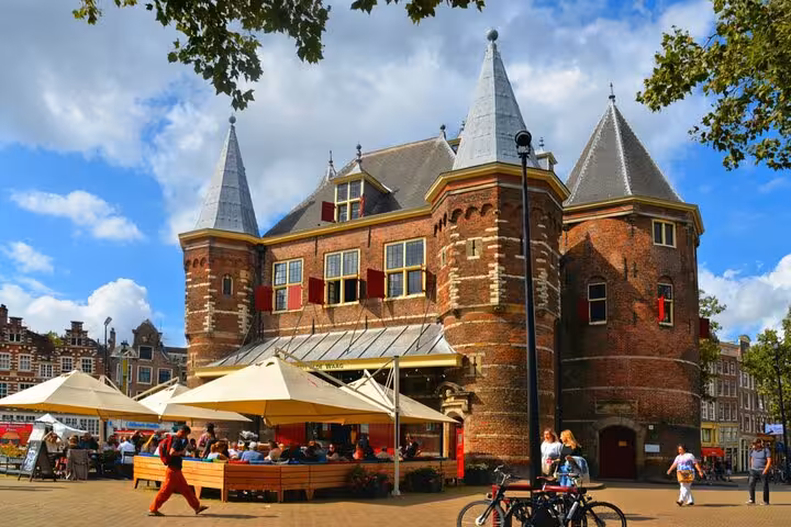 Historic De Waag building in Amsterdam Nieuwmarkt square, a key landmark in the self-guided scavenger hunt tour.