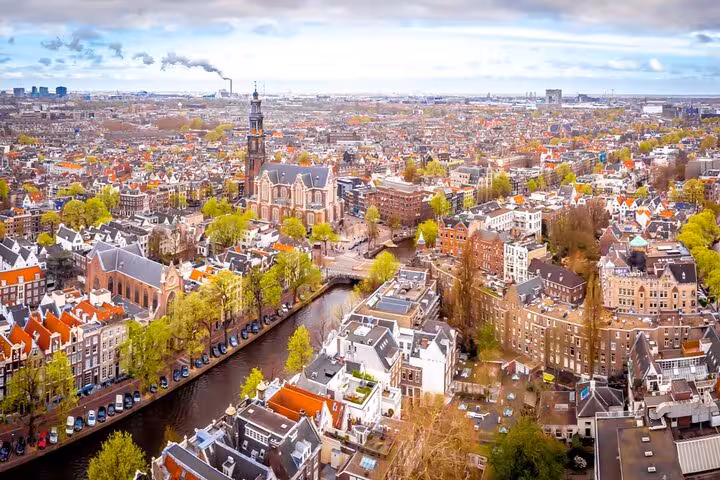 Aerial view of Amsterdam canals and historic rooftops perfect for a self-guided escape game scavenger hunt