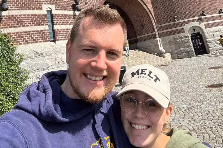 Happy couple taking a selfie near Helsingborg castle during a self-guided walking tour of the historic old town
