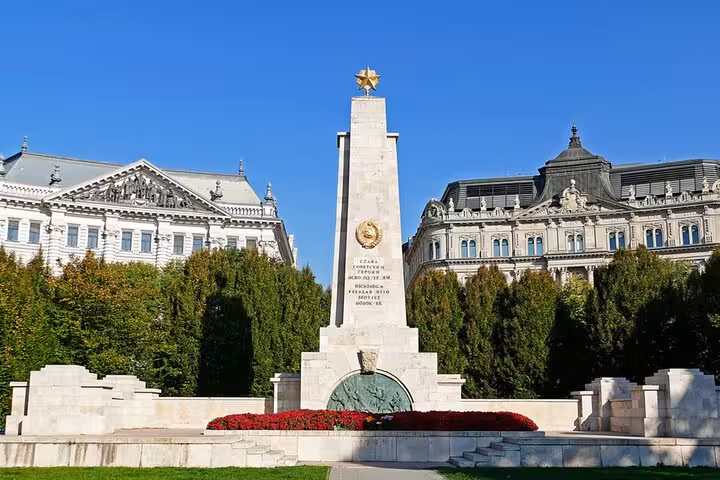 Soviet Memorial obelisk with golden star on Budapest's Liberty Square, a key stop on the detective mystery walking tour.