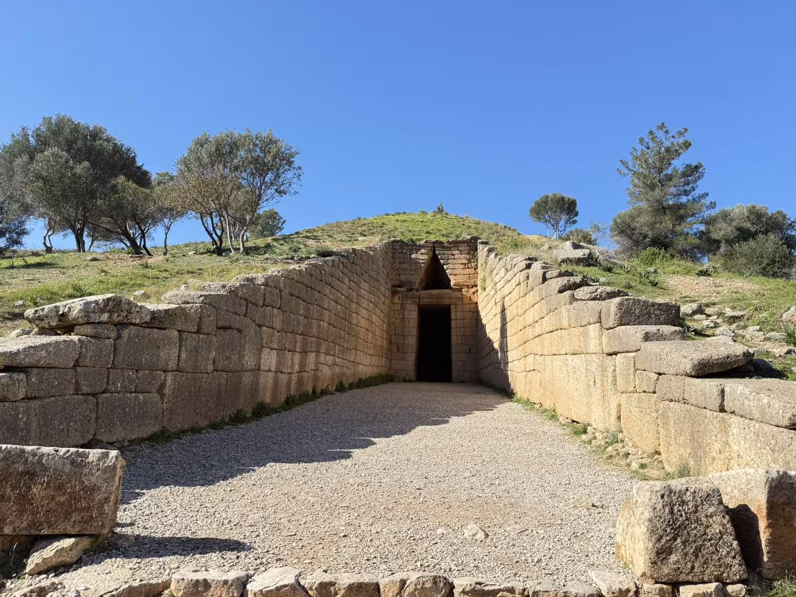 Treasury of Atreus dromos leading to Mycenaean tomb entrance on a private day tour in the Peloponnese Greece