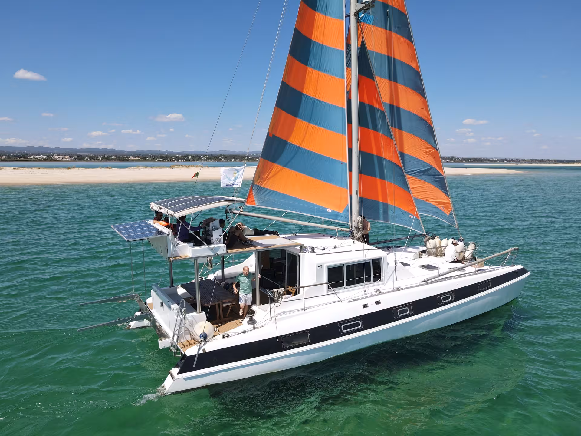Aerial view of sail catamaran anchored in turquoise Blue Lagoon waters on a full-day sailing and snorkeling tour