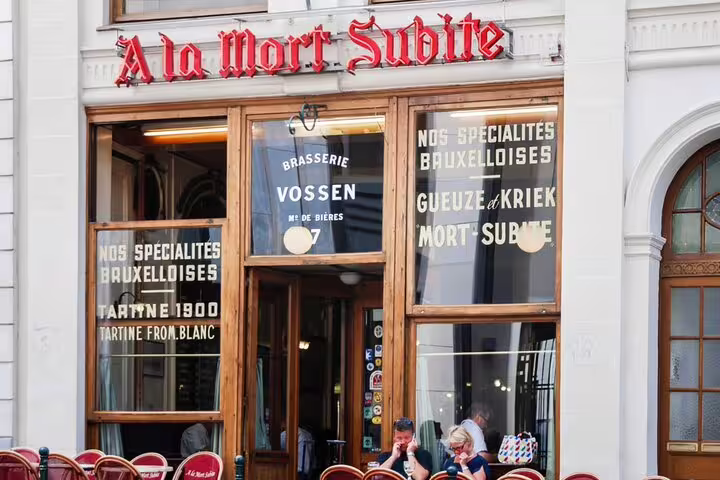 A la Mort Subite historic Brussels brasserie facade with outdoor seating and vintage signage