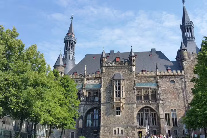 Aachen City Hall facade on a self-guided scavenger hunt tour, exploring historic Rathaus and Old Town