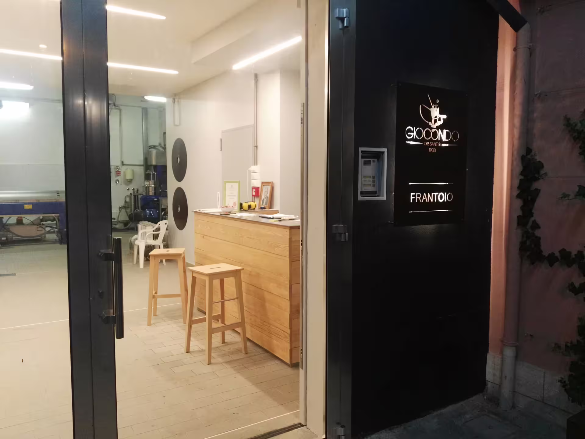 Entrance to an Abruzzo olive mill tasting room, welcoming guests for extra virgin olive oil tour and sampling