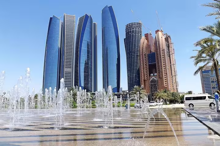 View the modern skyline of Abu Dhabi with iconic skyscrapers, part of the exciting city tour from Dubai in a 4x4 vehicle.