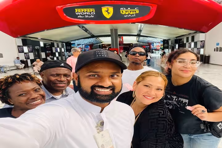 Happy tour group at Ferrari World Abu Dhabi on Abu Dhabi city tour from Ras Al Khaimah day trip
