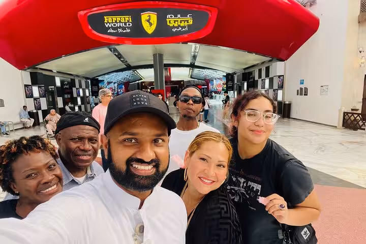 Guests selfie at Ferrari World Abu Dhabi entrance on Abu Dhabi city tour with included Ferrari World ticket