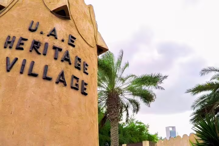 Explore UAE Heritage Village on a private Abu Dhabi full-day 4x4 tour, showcasing cultural history and palm-lined paths.