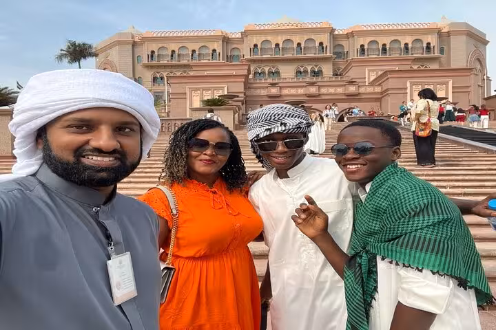 Travelers with local guide at Emirates Palace, Abu Dhabi layover city tour with seamless airport transfers