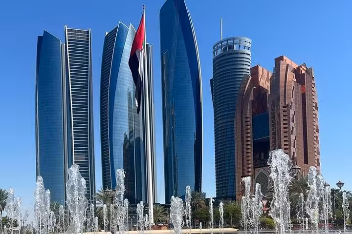 Abu Dhabi skyline with Etihad Towers and fountains, ideal stopover sightseeing tour with airport transfer