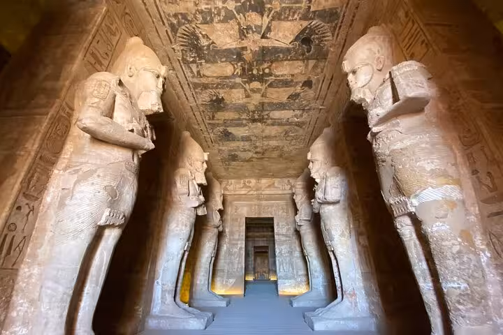 Grand hall with colossal statues inside Abu Simbel temples, private Aswan day tour with hotel pickup