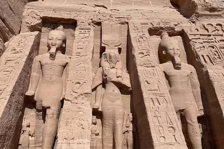 Abu Simbel temple carvings and colossal statues on a 7-day luxury Egypt Cairo pyramids Nile cruise flight tour