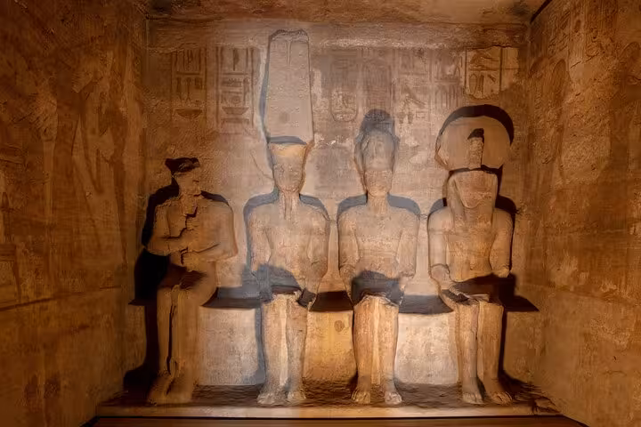 Interior statues and wall carvings at Abu Simbel temples on private day tour from Aswan with hotel pickup