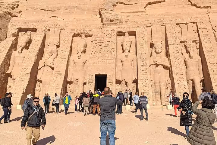 Tourists entering Abu Simbel Small Temple of Nefertari, private day tour from Aswan with hotel pickup