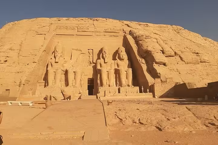 Abu Simbel Full Day Tour from Aswan featuring the Great Temple of Ramses II entrance and colossal statues