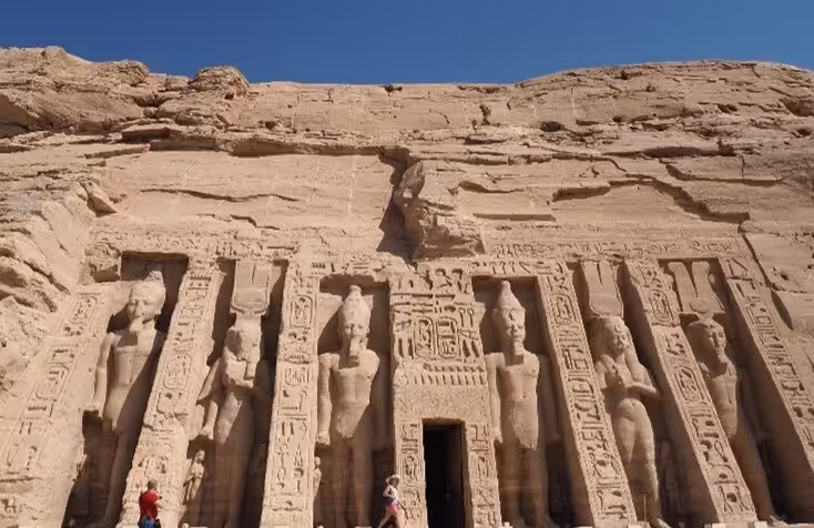 Colossal statues carved into the facade of the Small Temple of Abu Simbel, Aswan, Egypt