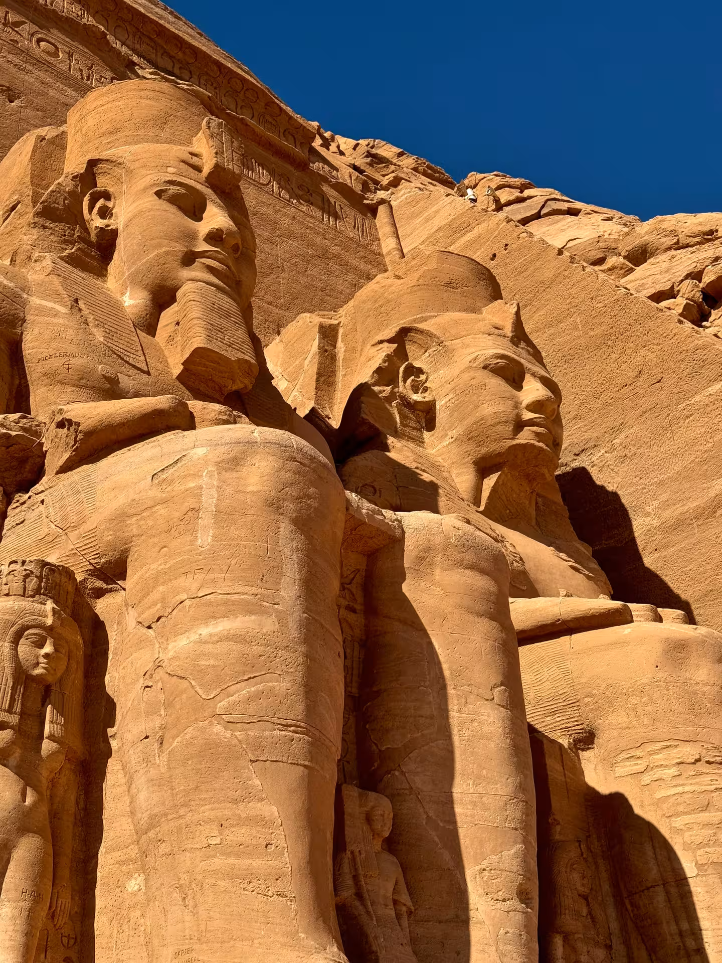 Colossal sandstone statues of Ramesses II at Abu Simbel Temples facade, Aswan, Egypt