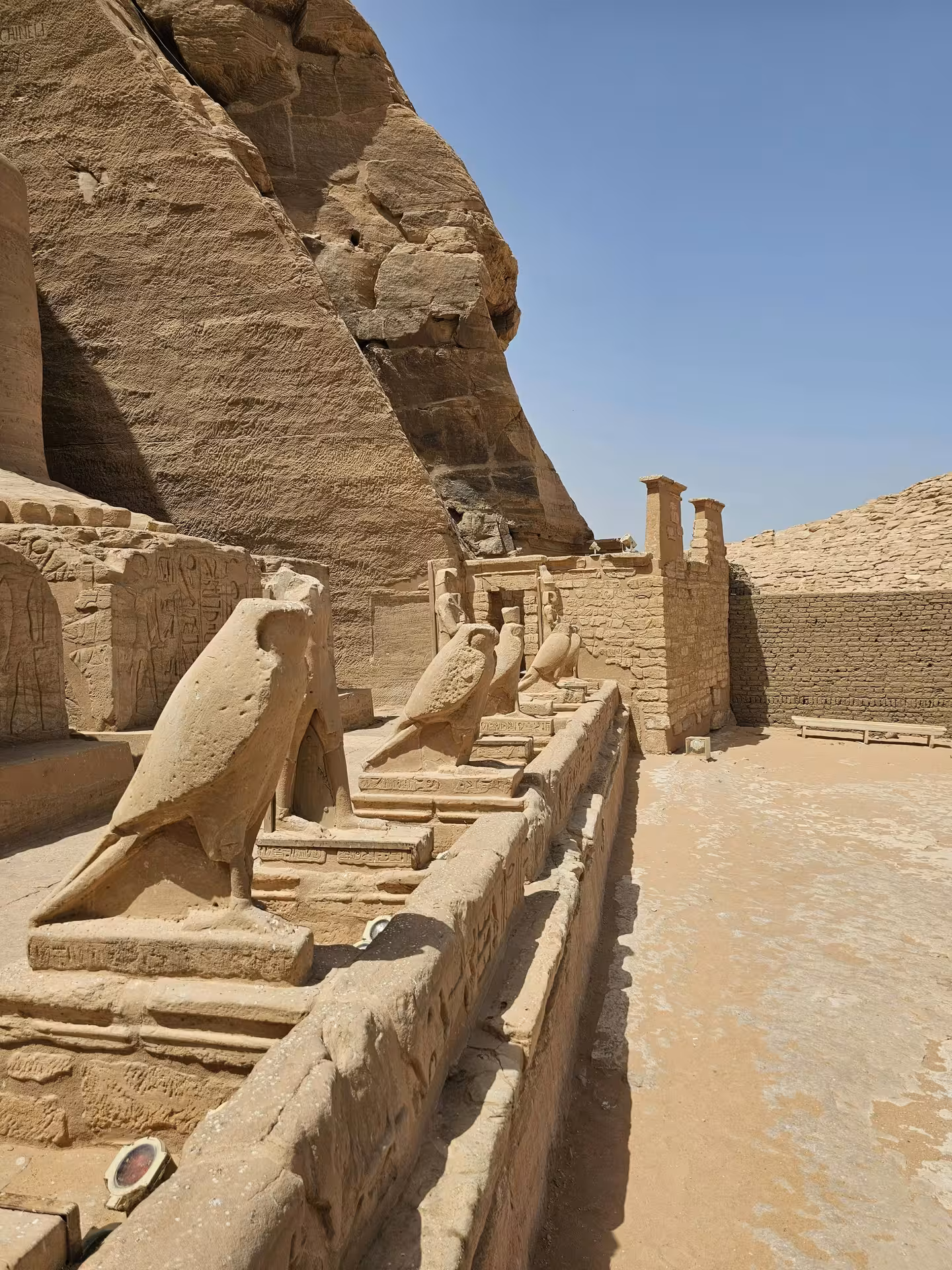 Falcon statues and hieroglyphic carvings at Abu Simbel temple complex, Aswan, Egypt