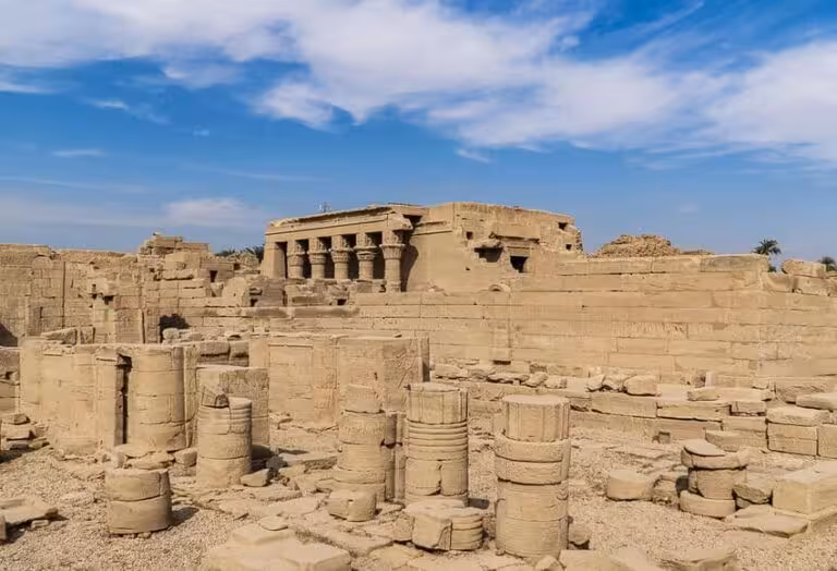 Abydos Temple ruins and ancient limestone columns under blue sky, featured on 2-day Egypt heritage tour