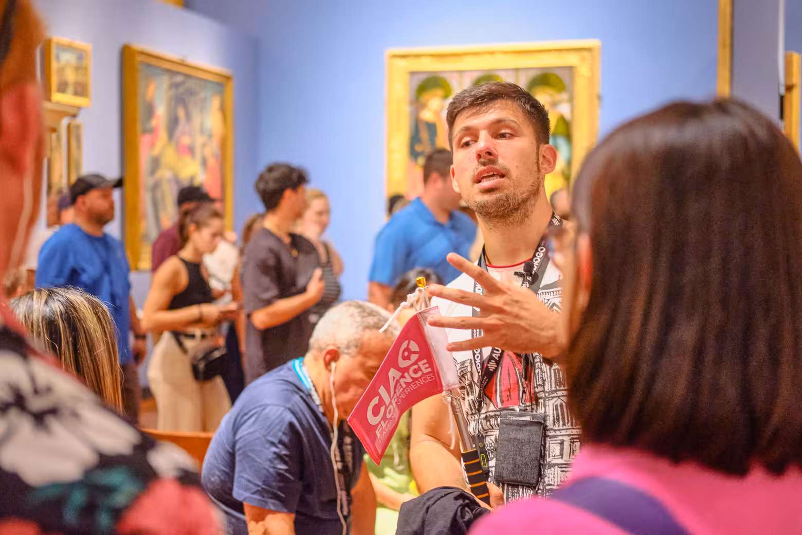 Guide leading an informative art discussion at Accademia Gallery, Florence during a skip-the-line tour.