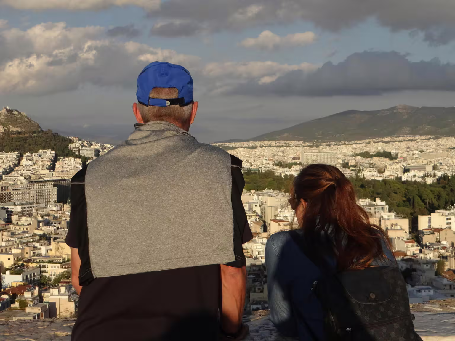 Visitors overlooking Athens from the Acropolis viewpoint on a skip-the-line guided walking tour in Greece