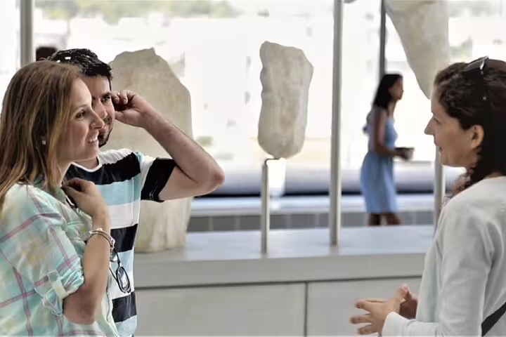 Guide briefing visitors inside the Acropolis Museum, part of Athens Parthenon walking tour option