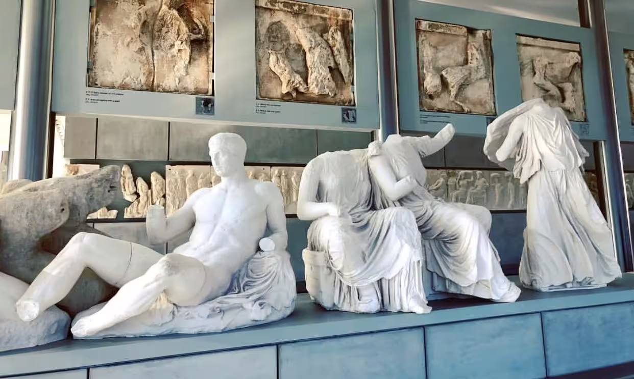 Classical marble statues displayed in the Acropolis Museum gallery, highlight of Athens Acropolis tour