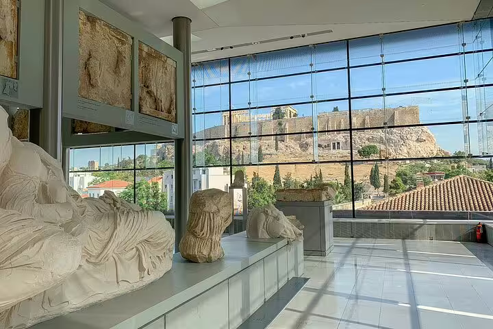 Acropolis Museum gallery with sculptures and panoramic Parthenon view, featured on Athens classical private tour