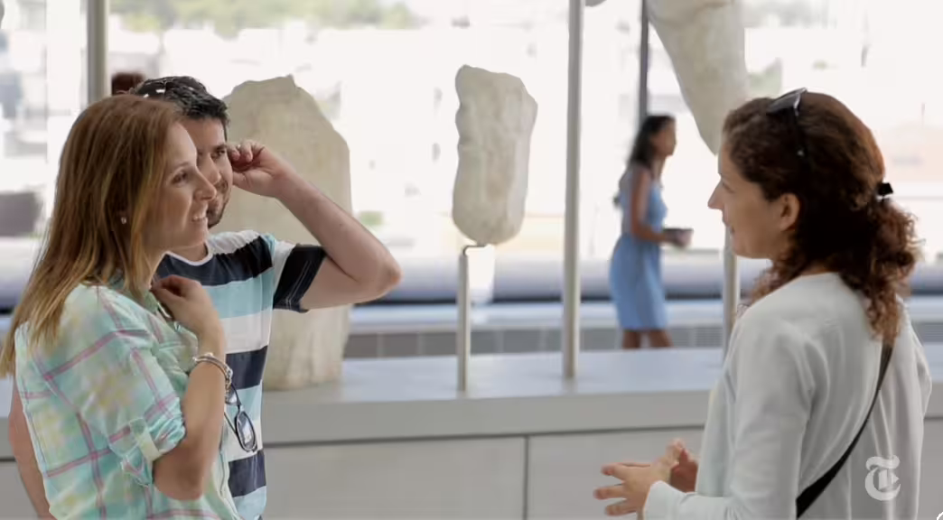 Visitors with guide inside Acropolis Museum, Athens, on skip-the-line tour with Greek lunch included