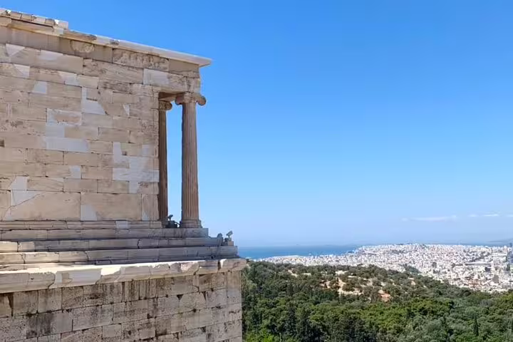 Acropolis temple columns overlooking Athens city and sea on small group Acropolis and Parthenon tour with lunch