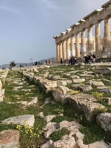 Walking the Acropolis sacred path beside the Parthenon columns on Viator Exclusive Acropolis and museum tour