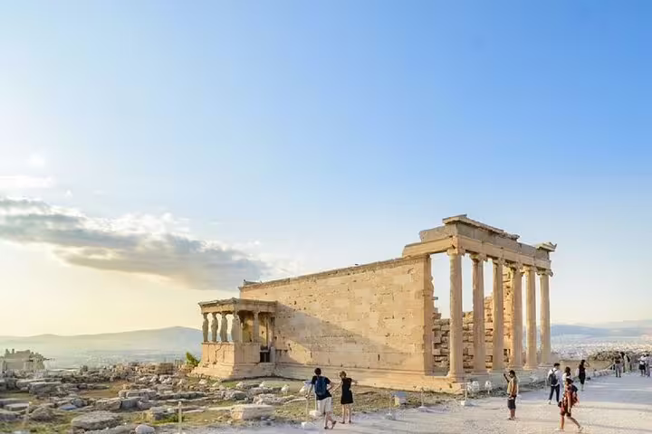 Sunset view of Acropolis temple ruins in Athens on Parthenon walking tour, with optional New Acropolis Museum