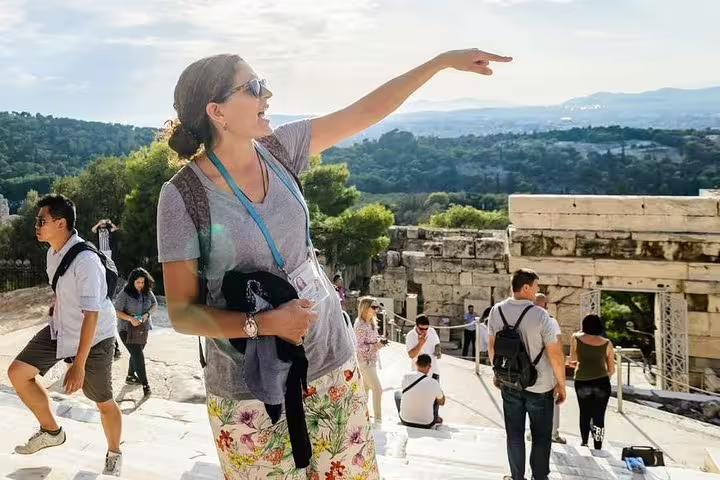 German-speaking guide points out Acropolis monuments on skip-the-line tour with panoramic Athens views